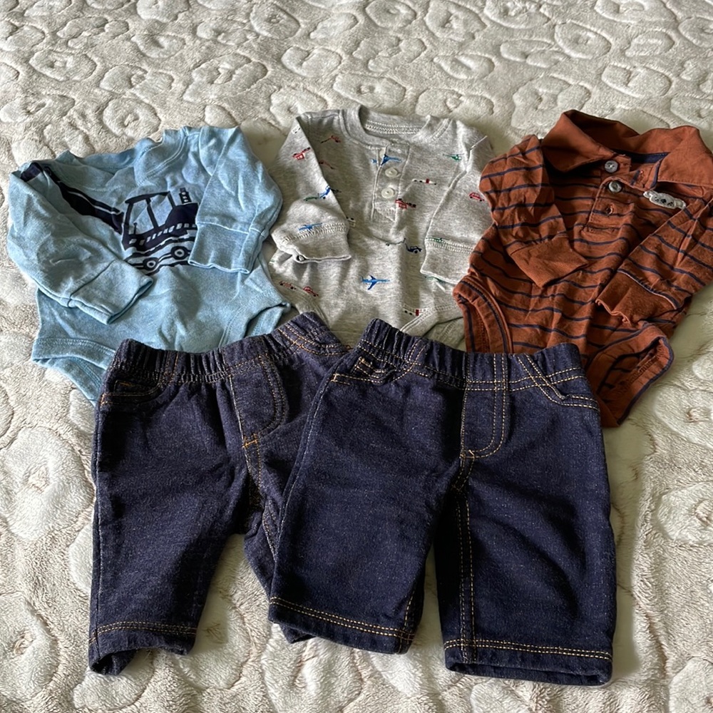 Carter’s Newborn Onesies w/2 pair of pants included